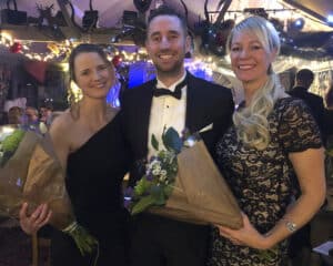 Three members at Biddenden Squash Club’s black-tie dinner dance in Kent, with two receiving flowers in recognition of their contributions to the club, an England Squash-affiliated club.